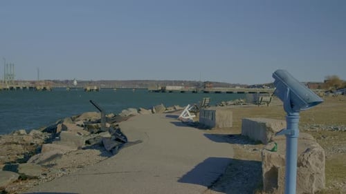 Binoculars On Shore Of Portland In Maine, USA. wide shot