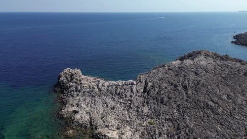 Aerial View of Rocky Coastline Meets the Ocean