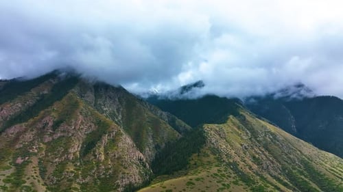Mountain peaks shrouded in clouds and mist