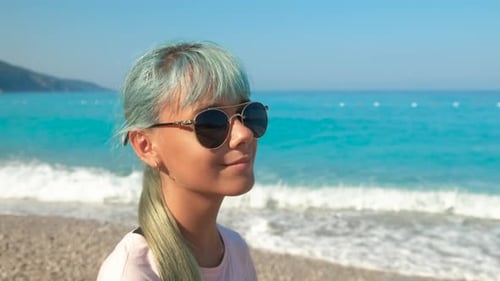 Lovely Teen on Ocean Pebbles