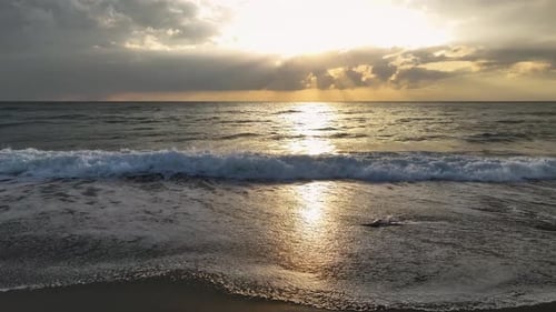 Aerial View The Golden Sunset Over the Mediterranean Creates a Magical Moment with Clouds and