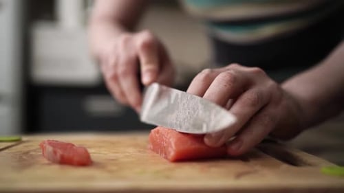 Close Up of Salmon being Cut on Board