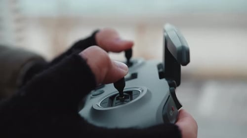Hand Operating Drone Controller with Fingerless Gloves