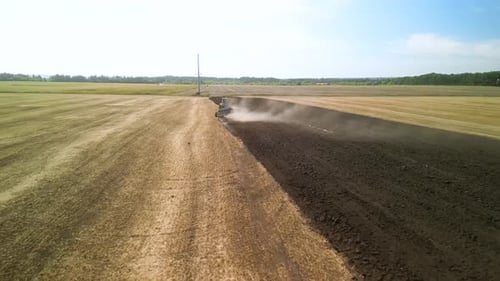 Tractors plowing the field in Ukraine