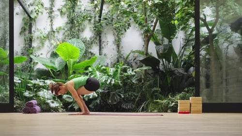 Woman in peaceful lotus position in modern studio