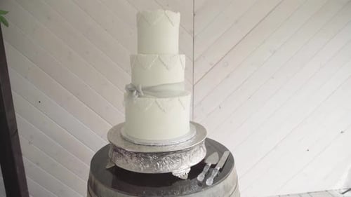 Elegant White Wedding Cake Decoration on Barrel