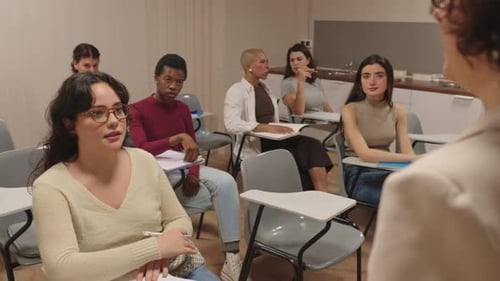 University Student Asking a Question During a College Lecture