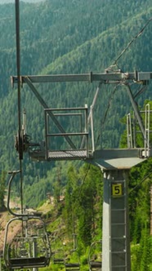 Ski Lift on Steep Mountain in Tropical Landscape