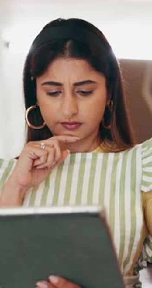 Small business, tablet and thinking with designer woman in workshop for planning or research