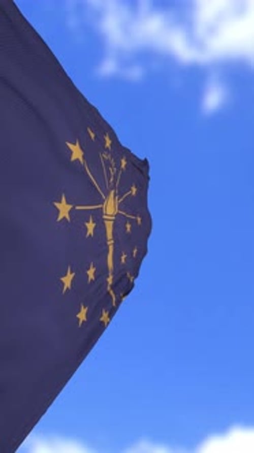Waving Indiana State Flag in Blue Sky Vertical