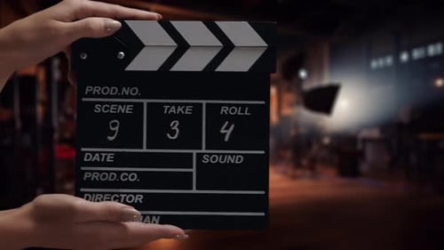 Human Hands are Using a Clapperboard on Set Beginning of Scene in Film or TV Television Production