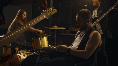 Diverse Music Band Members Getting Ready for Rehearsal in Studio