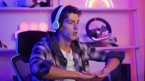 Man Playing Video Games with Headphones and Controller