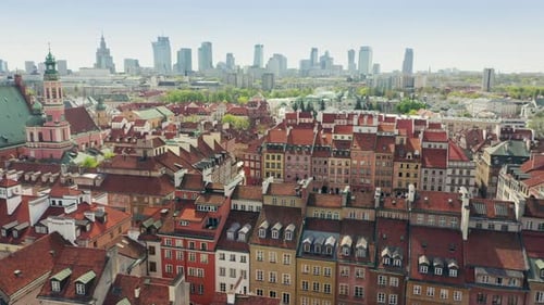 The market square of the Old City in Warsaw against the backdrop of skyscrapers.