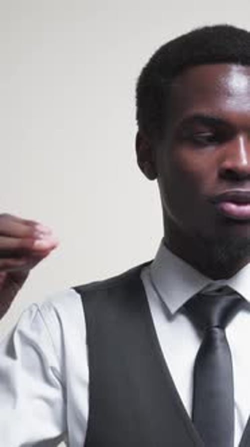 Young Adult Speaking and Gesturing Indoors