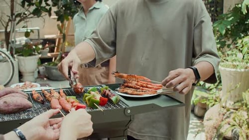 Friends Enjoying a Relaxed Outdoor Barbecue Together