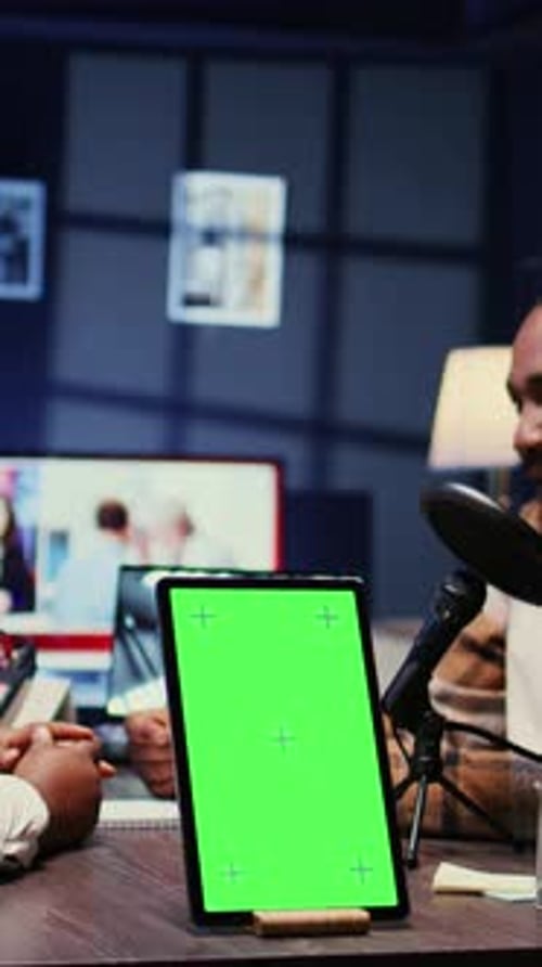 Vertical Video Chroma Key Tablet Next to Cohosts Streaming Podcast