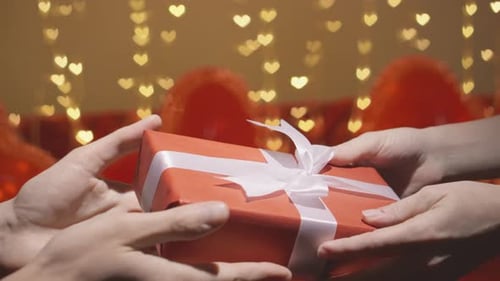 Gift Exchange with Heart Balloons and Lights