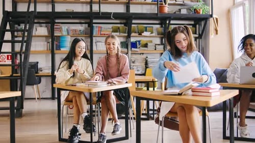 Smiling Students Studying in a Bright Library