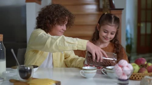 Children Enjoying Breakfast Together at Home
