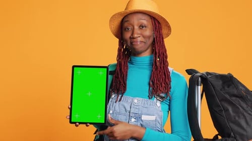 Cheerful Woman Holding Tablet in Studio