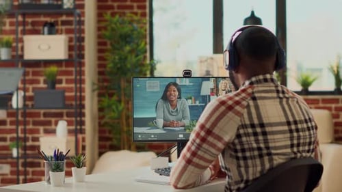 Man Attends Meeting From Home Office