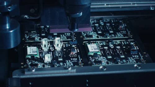Factory Machinery at Work: Printed Circuit Board Being Assembled with Automated Robotic Arm, Pick a