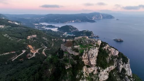 Majestic aerial drone view of Angelokastro, a Byzantine castle on a steep cliff,