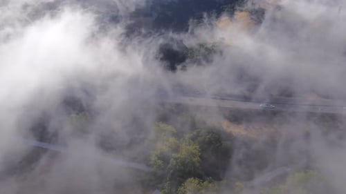 Low lying fog caught in the chill air between hills in Southern California near San Luis Obispo -