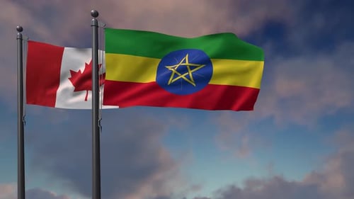 Canada and Ethiopia Flags Waving on Flagpoles Loop