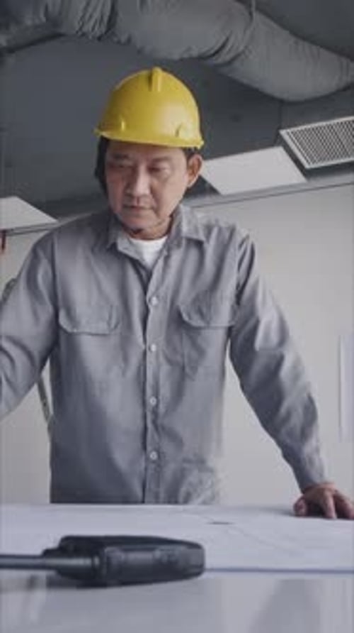 Vertical of Engineer Editing Blueprint