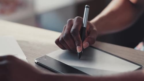 Close Up of Hand Afro American Man Use Graphic Tablet Job Computer House Internet Office Technology