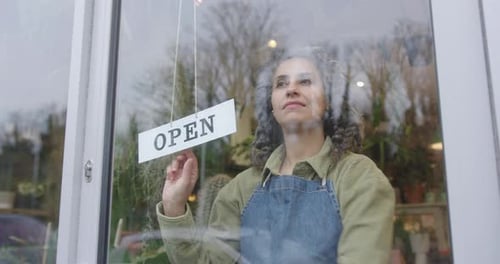 Female Small Business Owner Opening Store, Door with Open Sign