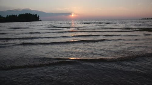 Beautiful landscape with small waves with sea sunset