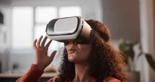 Young Woman Enjoys Virtual Reality at Home