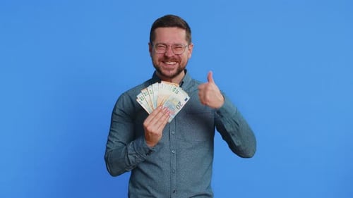 Rich Happy Man Winner Waving Money Euro Cash Like a Fan Big Income Wealth Success Business
