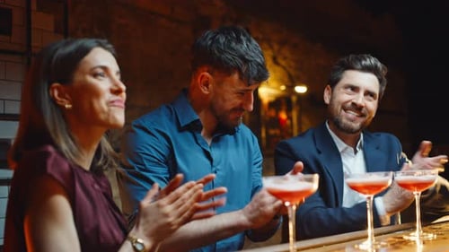 Excited People Clapping Hands at Evening Bar Closeup Friends Raising Cocktails