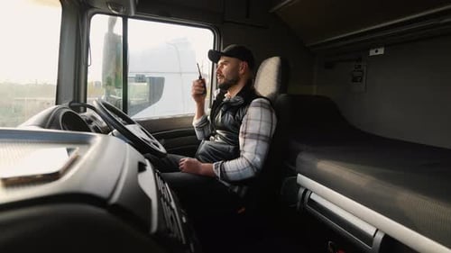 Truck Driver Communicating Using a Handheld Radio