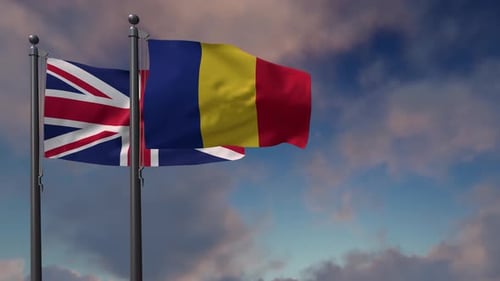 United Kingdom and Romania Flags Waving in Blue Sky