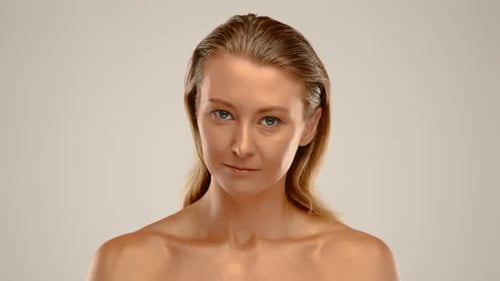 Confident LightHaired Girl in Bright Room Golden Skin Tone