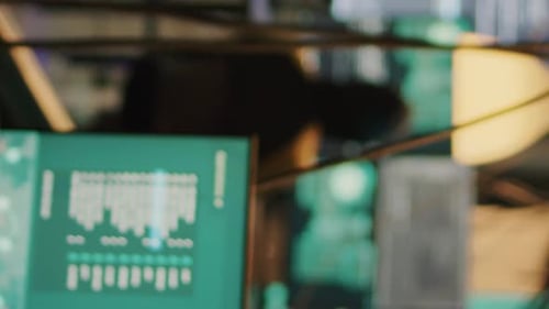 Hacker Works With Computer Code on Multiple Screens