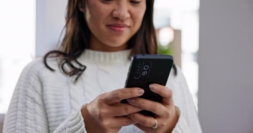 Woman Using Mobile Phone Device in Bright Room