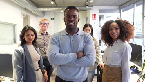 Confident Business Team Posing in Modern Coworking Office