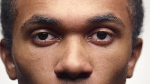 Intense Young Man's Direct Stare in Close-Up