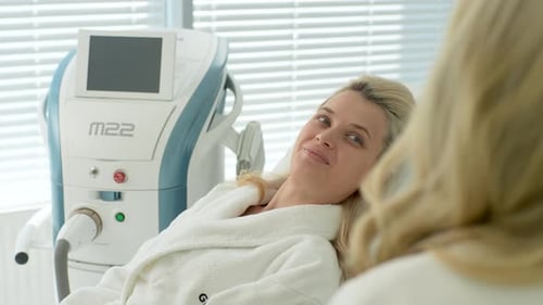 Closeup Rear View of Unrecognizable Cosmetician Consultation Blonde Female Before Rejuvenation