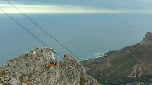 View Of Cable Car Descending On Table Mountain In Cape Town, South Africa. Tracking Shot