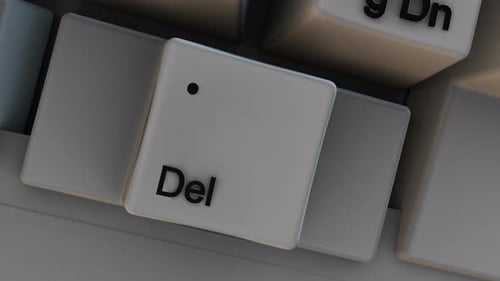 Slow Moving Close-up of Del Delete Button Key on Computer Keyboard.