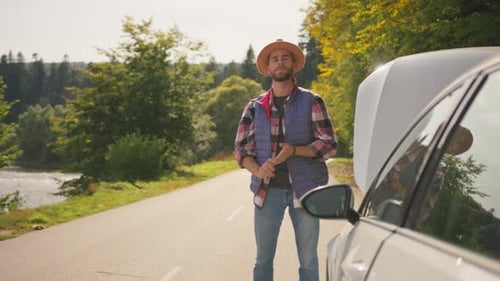 Sad Traveler Hipster Guy Standing Near Broken Car with Opened Hood Stressful Driver with Breakdown