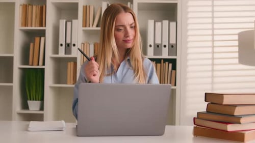 Caucasian Happy Female Student Girl at Home Library Studying Online with Books Laptop Distant