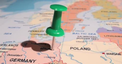 Germany - Travel concept with green pushpin on the world map. The location point on the map points